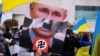 ISRAEL – Demonstrators hold up anti-war signs during a protest against Russia's invasion of Ukraine. Tel Aviv, March 20, 2022