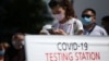 KAZAKHSTAN -- People wait to be tested for the coronavirus disease (COVID-19) at a mobile testing station in Almaty, June 17, 2020